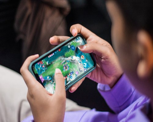 Mobile gaming demonstration shown on a smartphone screen during a technology showcase